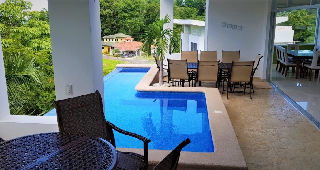 Punta Leona 6-bedroom villa with elevator, pool, ocean-view terrace, and club membership, steps from white-sand beaches.