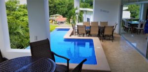 Punta Leona 6-bedroom villa with elevator, pool, ocean-view terrace, and club membership, steps from white-sand beaches.
