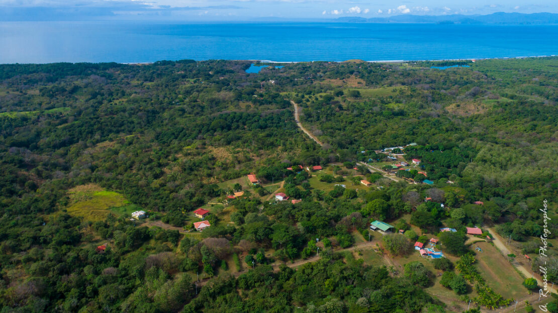 House with pool close to the beach in Guacalillo. Ocean views, solid construction, 0.75-acre setting, and optional adjoining lots available.