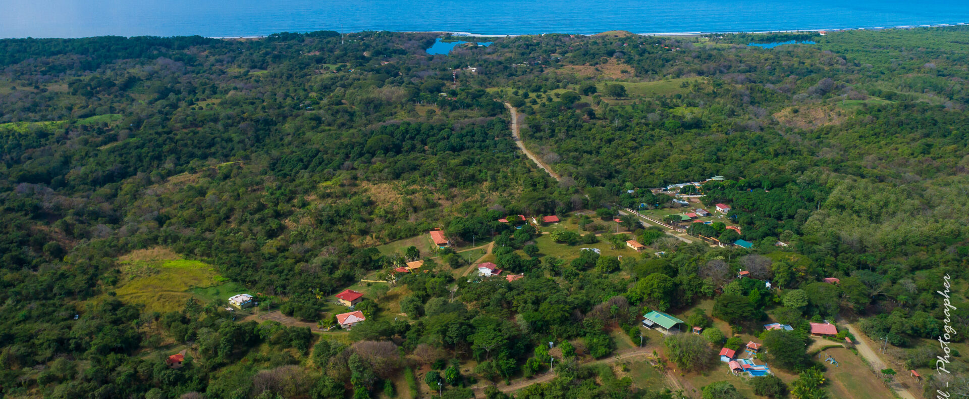 House with pool close to the beach in Guacalillo. Ocean views, solid construction, 0.75-acre setting, and optional adjoining lots available.