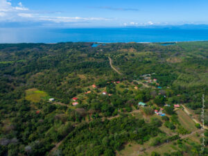 House with pool close to the beach in Guacalillo. Ocean views, solid construction, 0.75-acre setting, and optional adjoining lots available.
