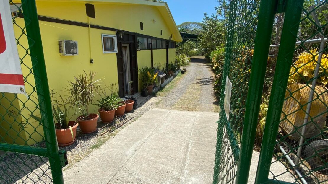 Herradura commercial residential property on a 1,637 m² lot with cabins, studios, and a spacious main house near Los Sueños and services.