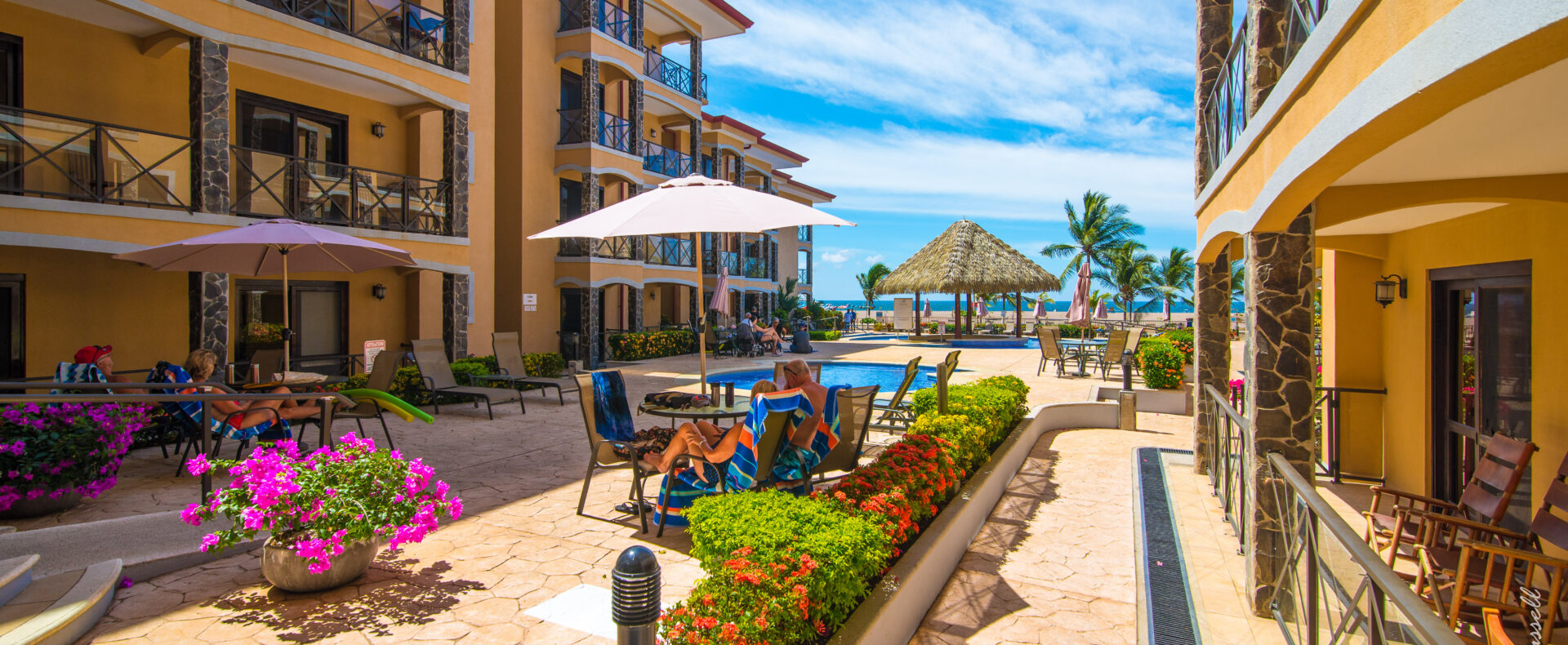 Jaco beachfront 3-bedrooms condo with ocean views, balconies, pools, and direct beach access. Fully equipped in Bahia Encantada.