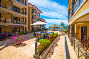 Jaco beachfront 3-bedrooms condo with ocean views, balconies, pools, and direct beach access. Fully equipped in Bahia Encantada.