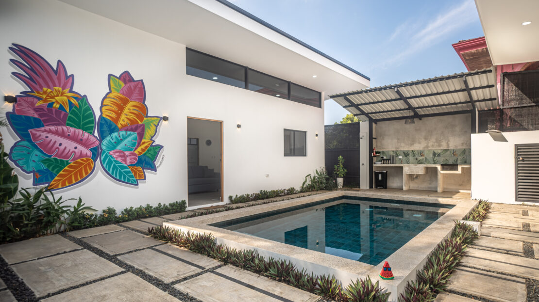 Herradura beachside dual-home property for sale. Turnkey furnished homes near Marina Los Sueños with private pool, parking, and no HOA fees.