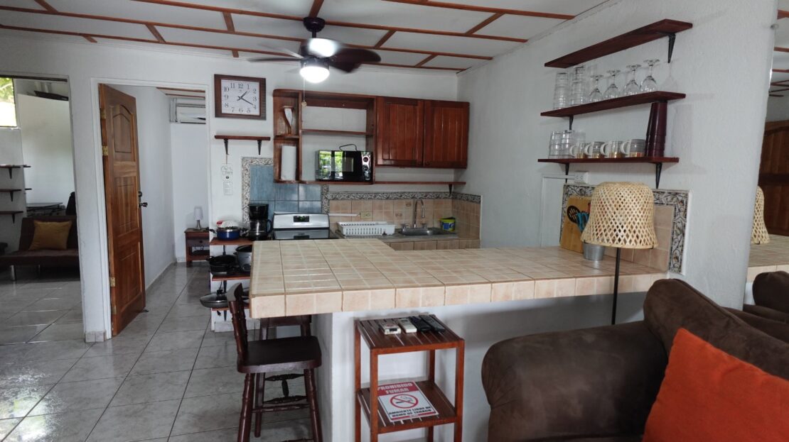 Jaco beachside retreat 3-bedrooms for sale. Furnished near the sand with pool, security, low fees, and a bright open layout in Jaco Sol.